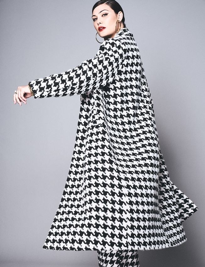 model wearing the long black and white houndstooth peacoat