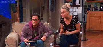Penny from the Big Bang Theory excitedly hitting Leonard and screaming oh my god