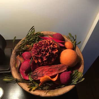 Autumnal potpourri in a wooden bowl on a desk