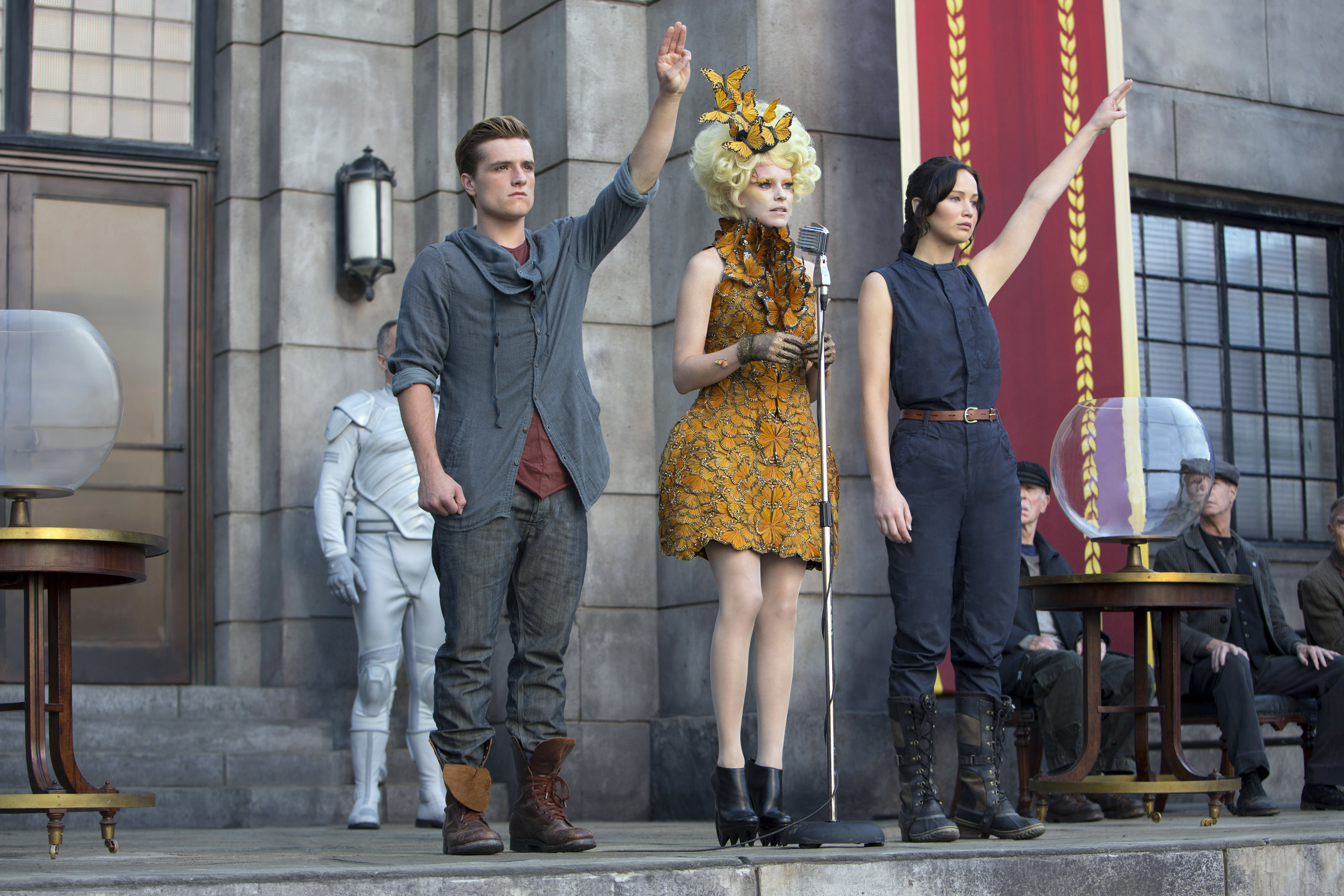 Effie stands in between Peeta and Katniss at the quarter quell reaping