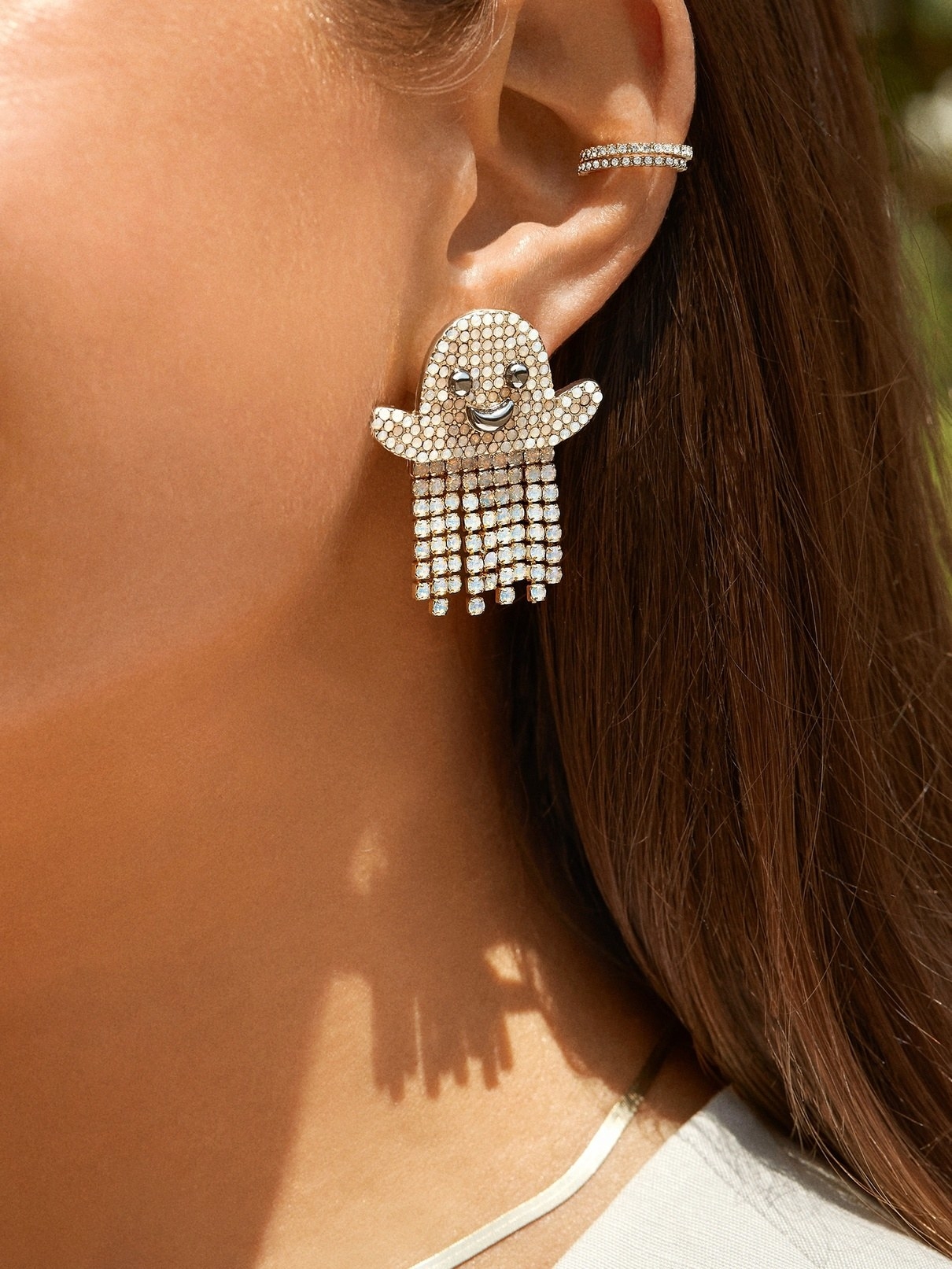 model wearing the ghost earrings with a cuff earring