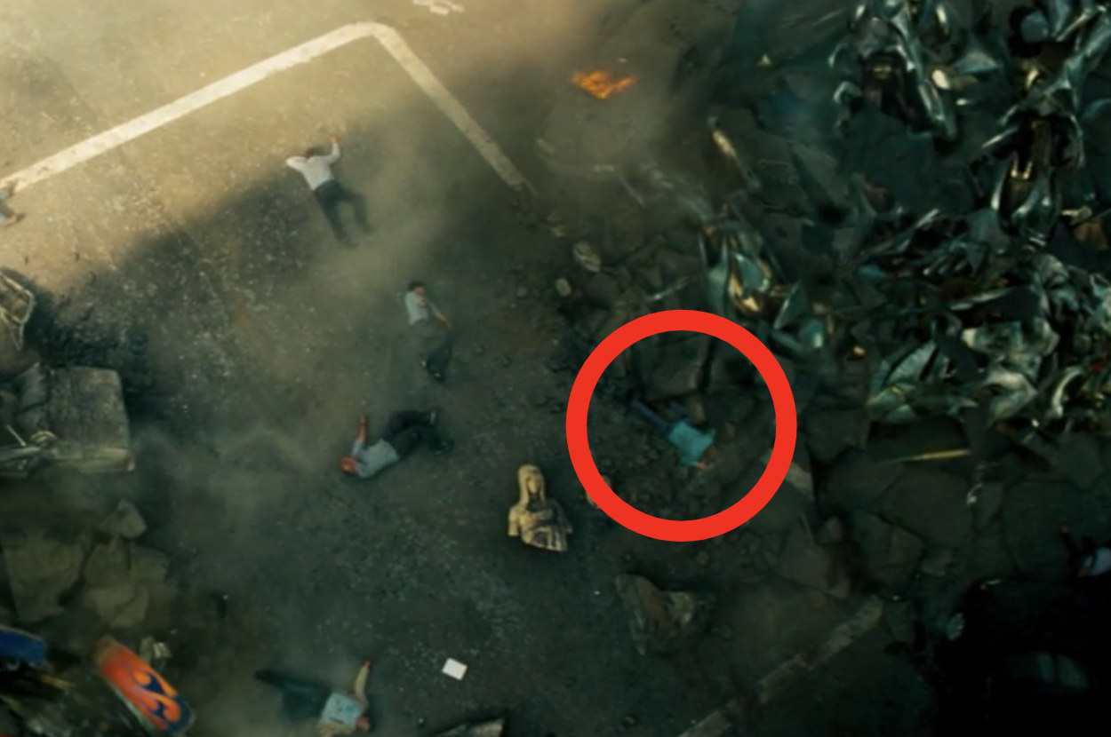 Michael Bay laying on the ground among other civilians