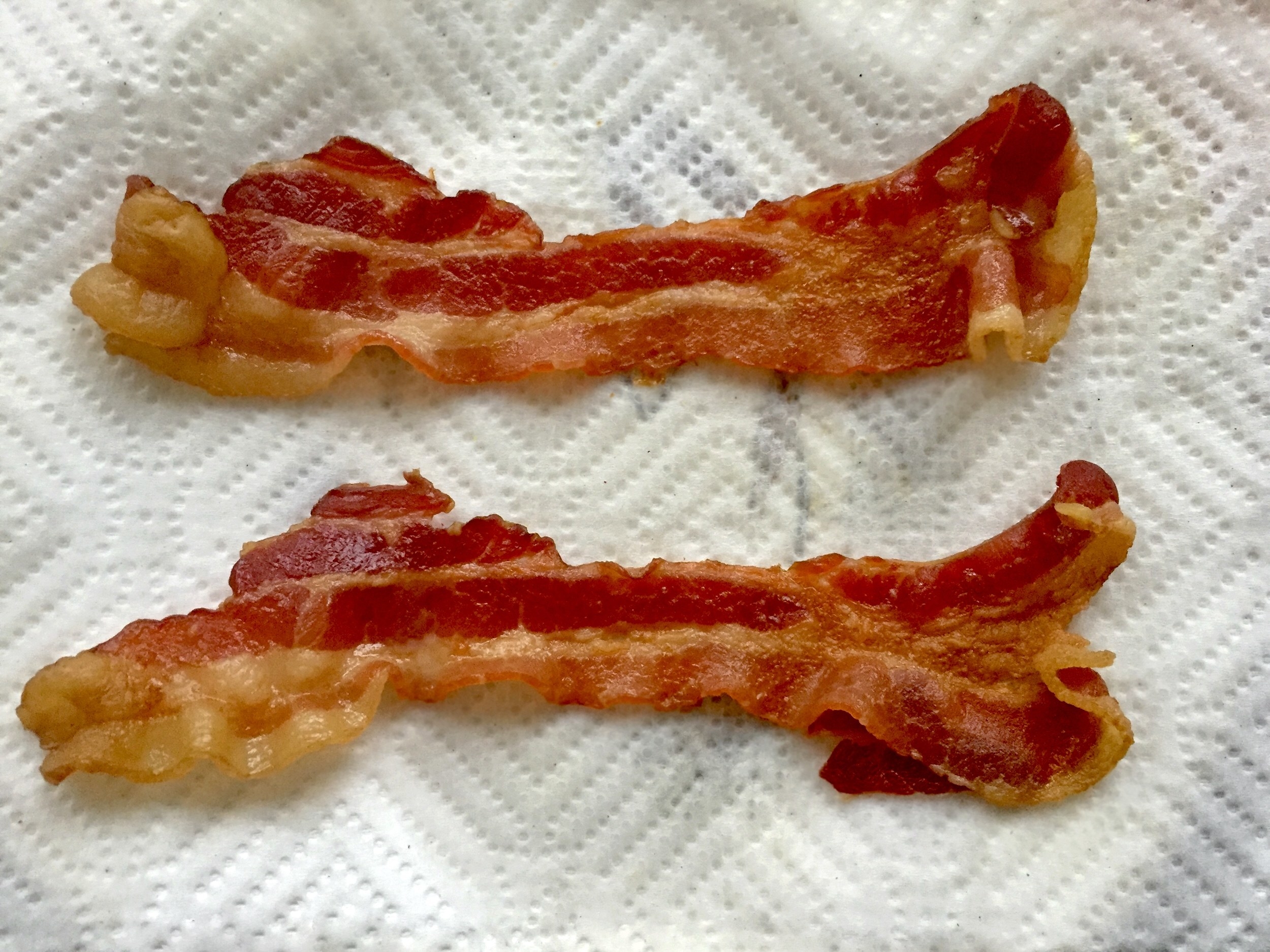 Bacon on a piece of paper towel.