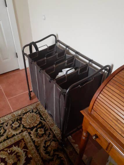 a reviewer photo of the cart broken into four sections with laundry in them