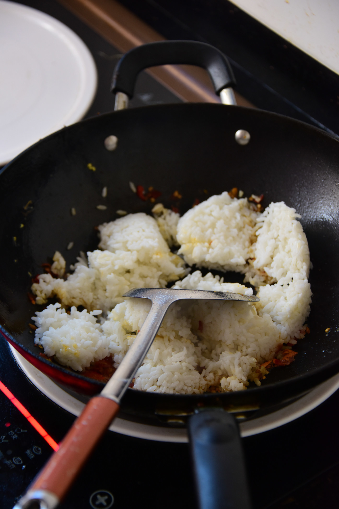 Frying rice in a wok.