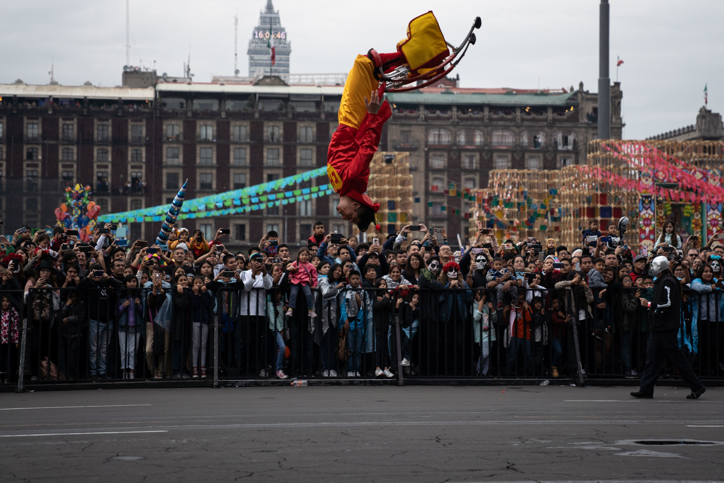 Person upside down in the air in front of a crowd