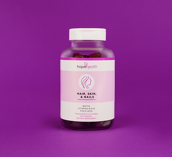 Product image of Hope Health Hair, Skin, &amp; Nails gummies over purple backdrop