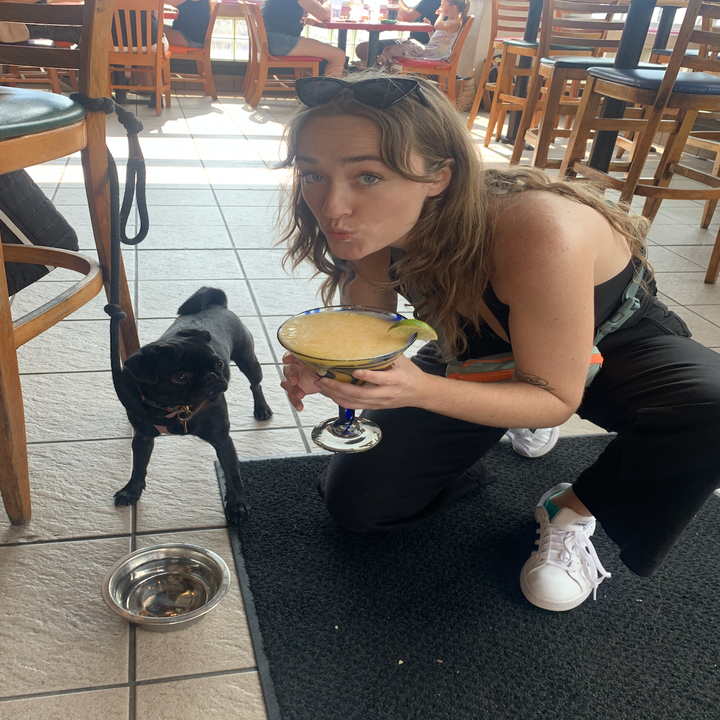 Syd with a big margarita, and Phoebe looking at it longingly