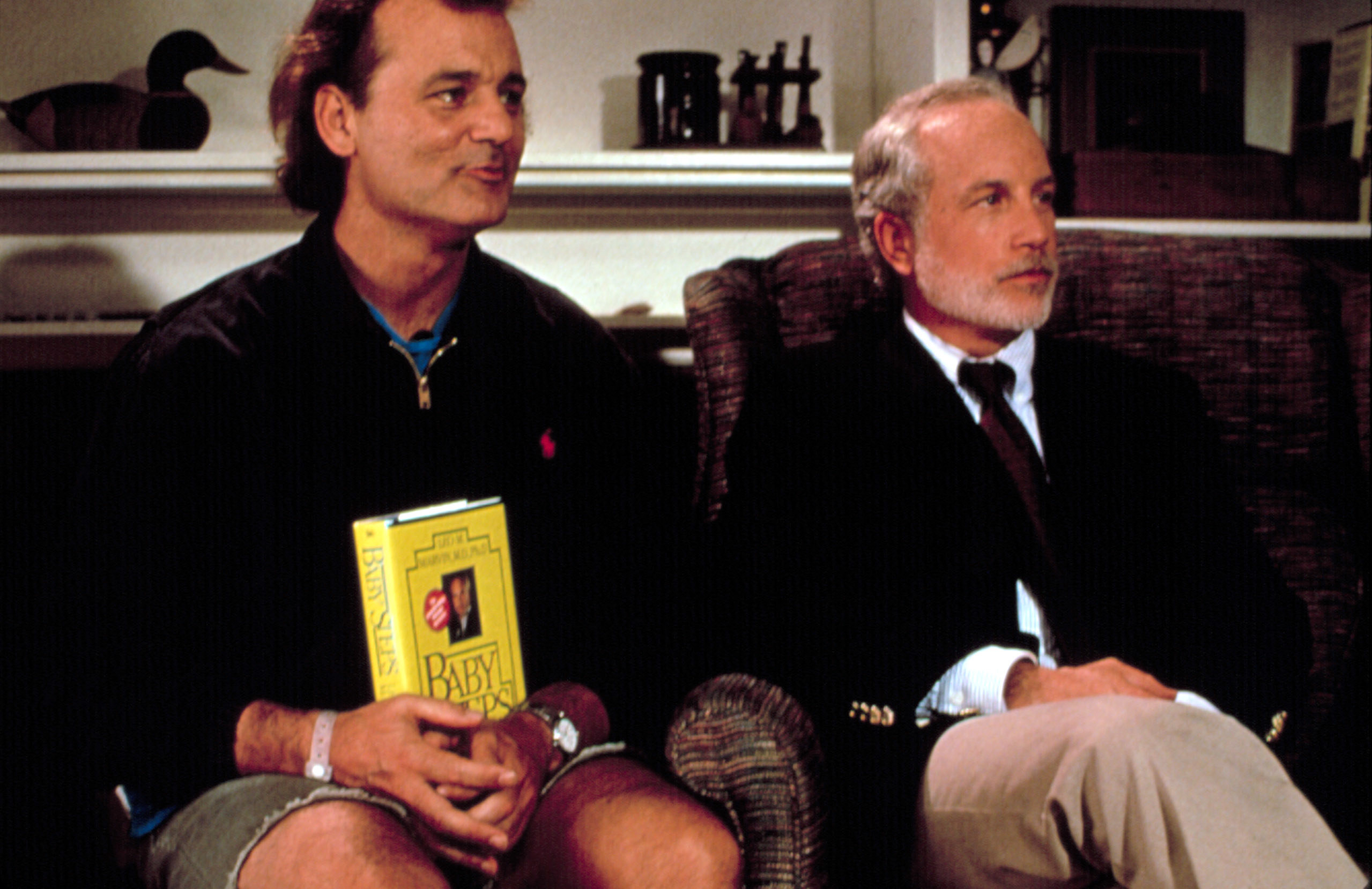 Bill Murray holding a book while Richard Dreyfuss looks nonplussed
