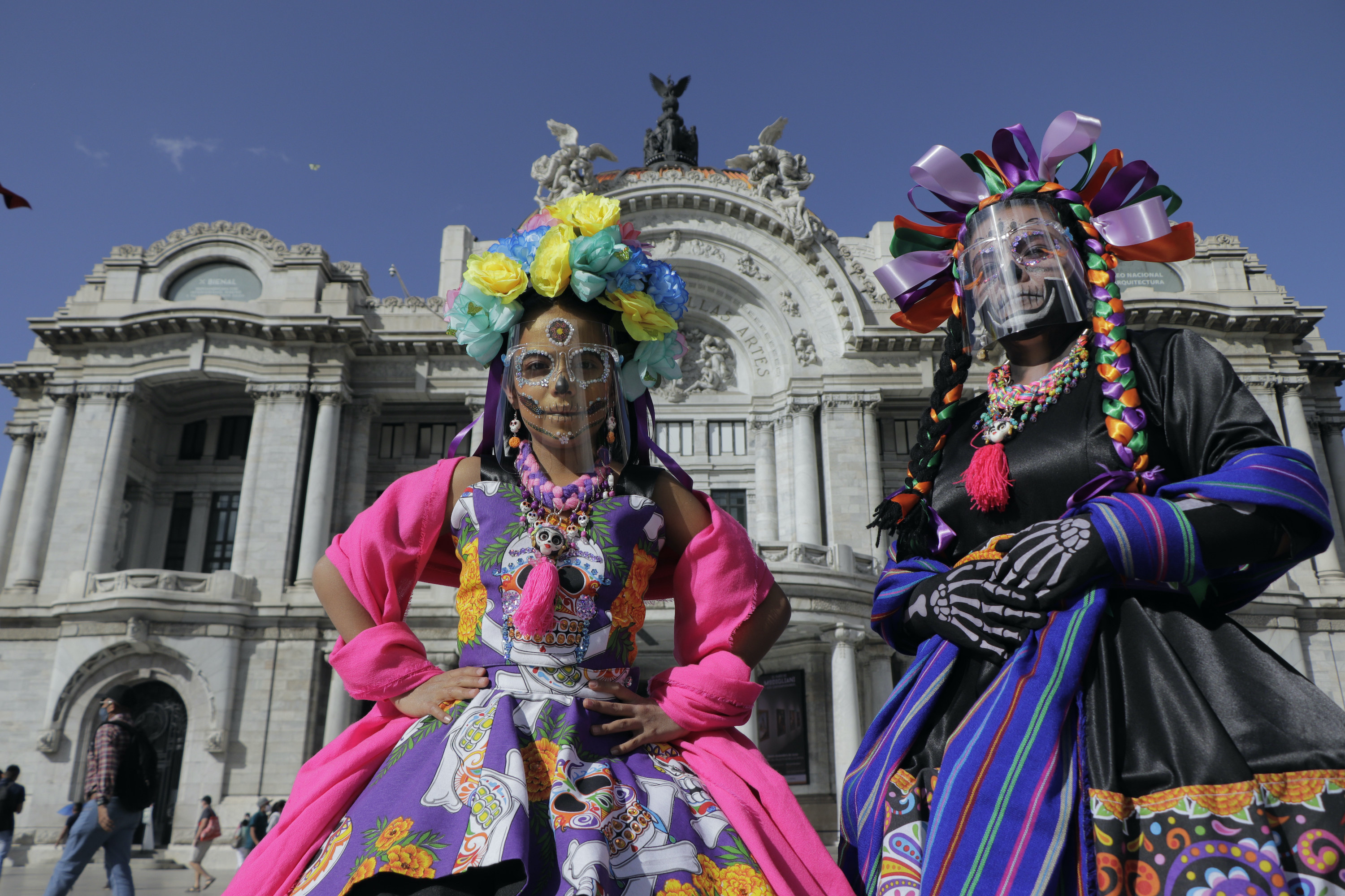 Two women wearing very bright costumes