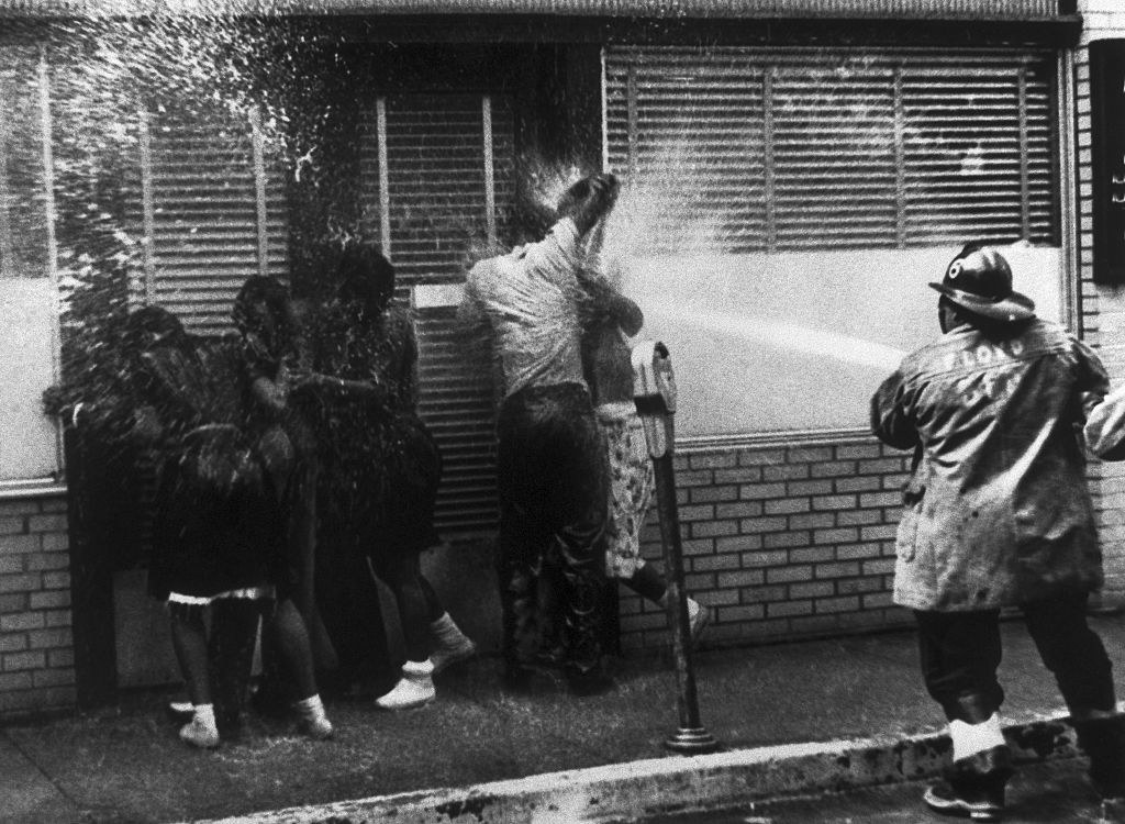 firefighters spraying Black protestors with a hose