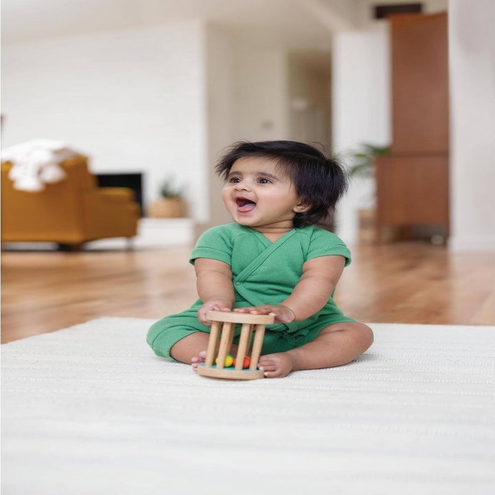 Child with rolling rattle