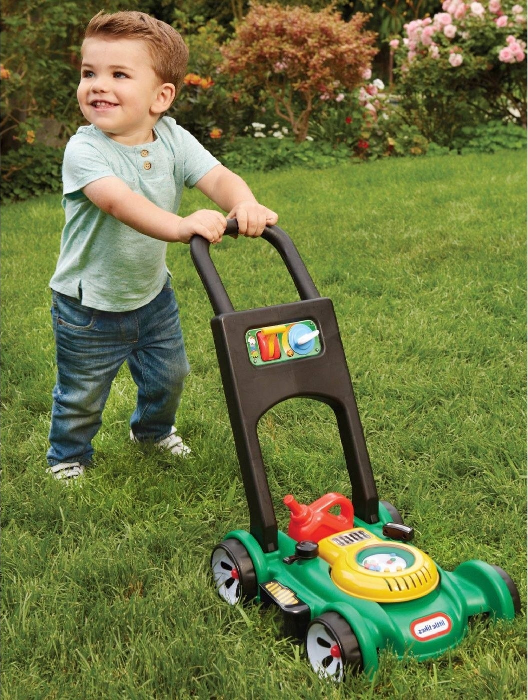 Kid pushing lawn mower