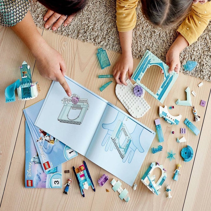 Kids playing with Frozen LEGO kit