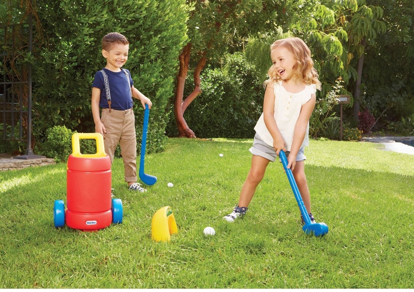 Kids playing with Little Tikes golf set