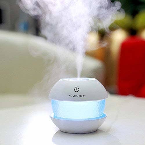 A humidifer with mist coming out of it