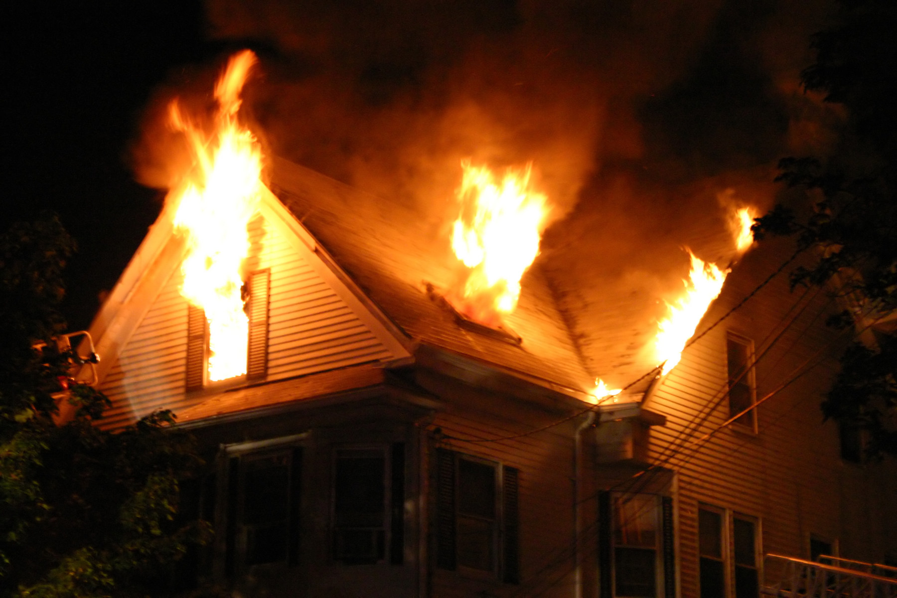 Second story of house on fire