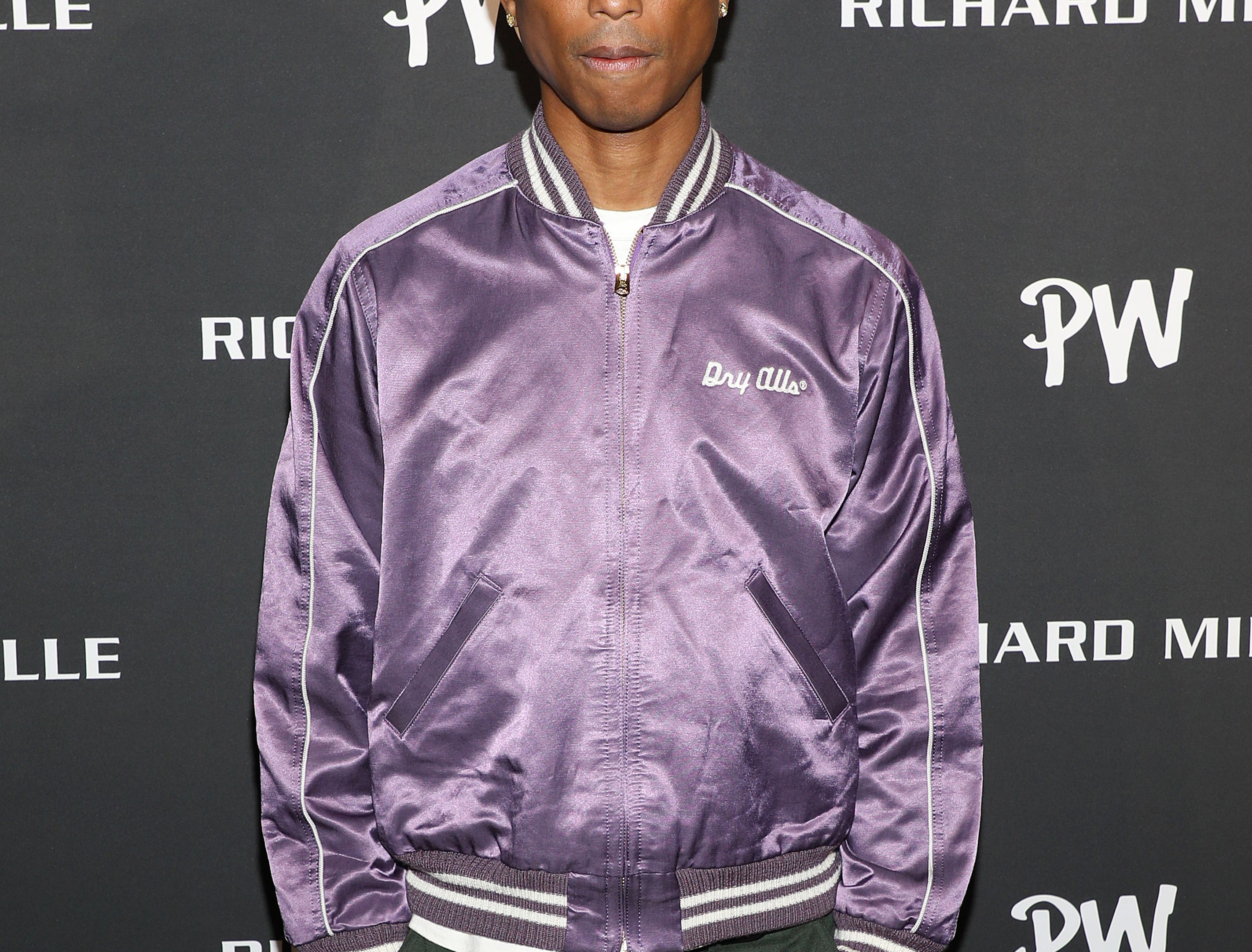 Pharrell on the red carpet in a satiny Dry Allls bomber jacket