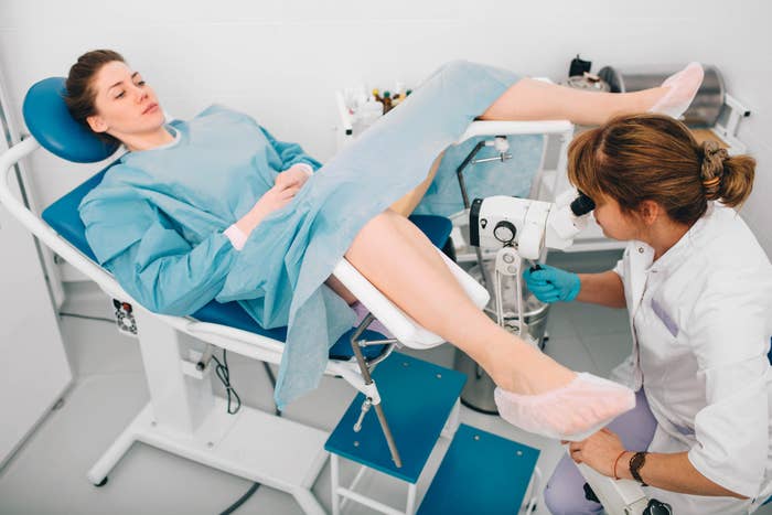 A woman getting a colposcopy