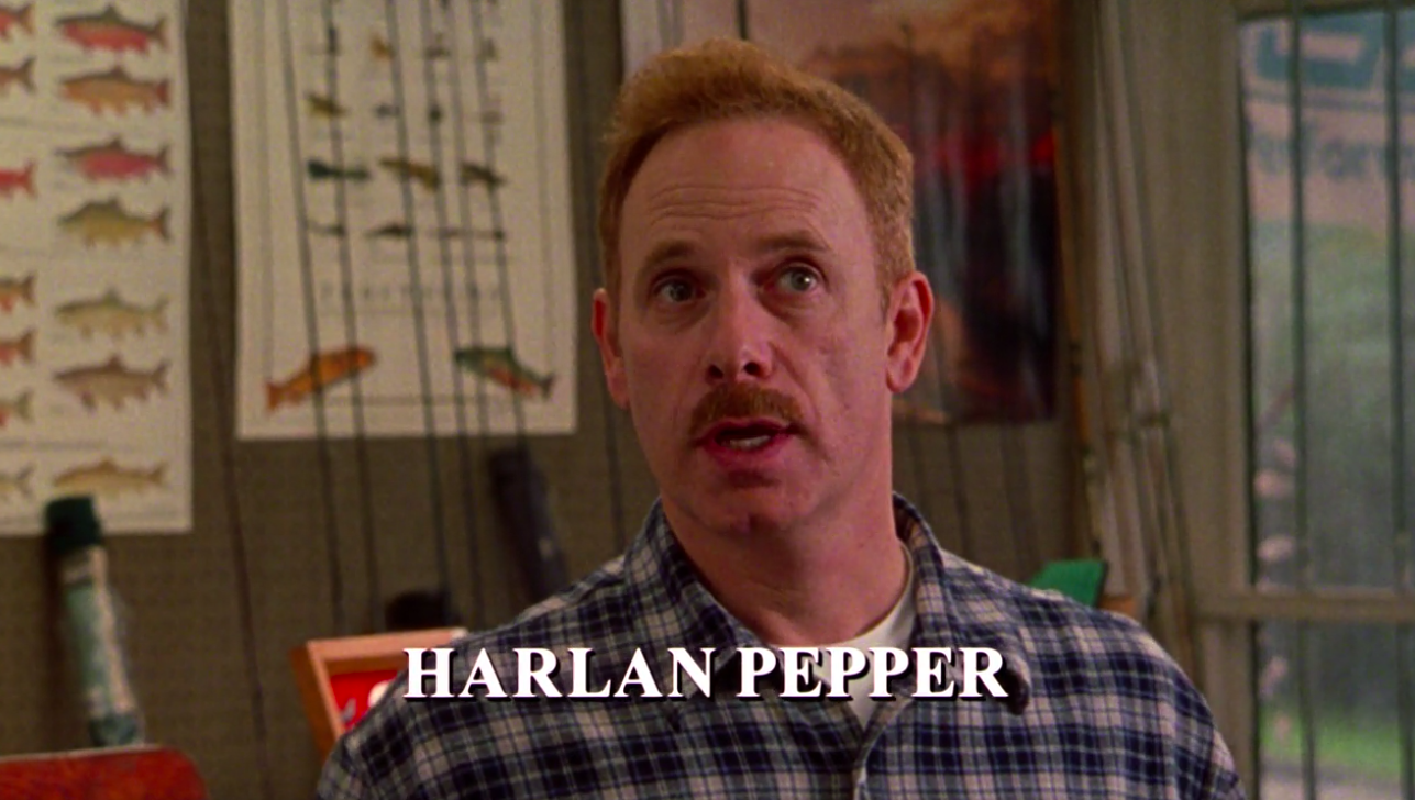 Christopher Guest with text on the screen reading &quot;Harlan Pepper&quot;