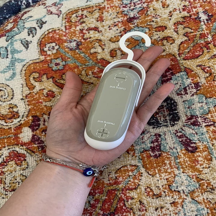 reviewer holding the sealer in their hand