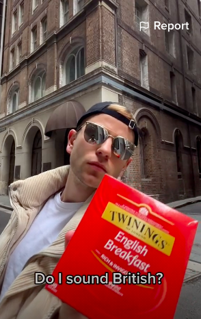 Pavel holding a box of Twinings English Breakfast tea withe caption &quot;Do I sound British?&quot;