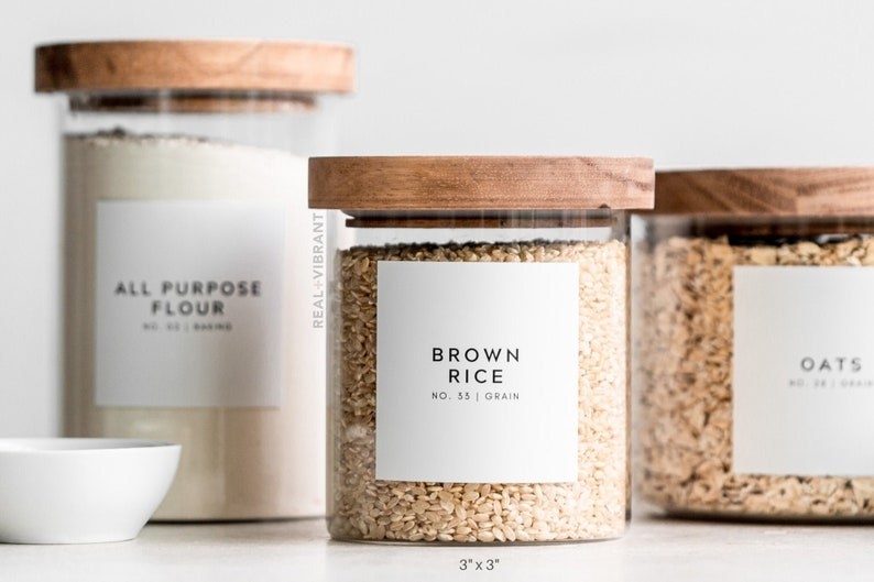 brown rice, oats, and all purpose flour in the clear containers with the labels on them