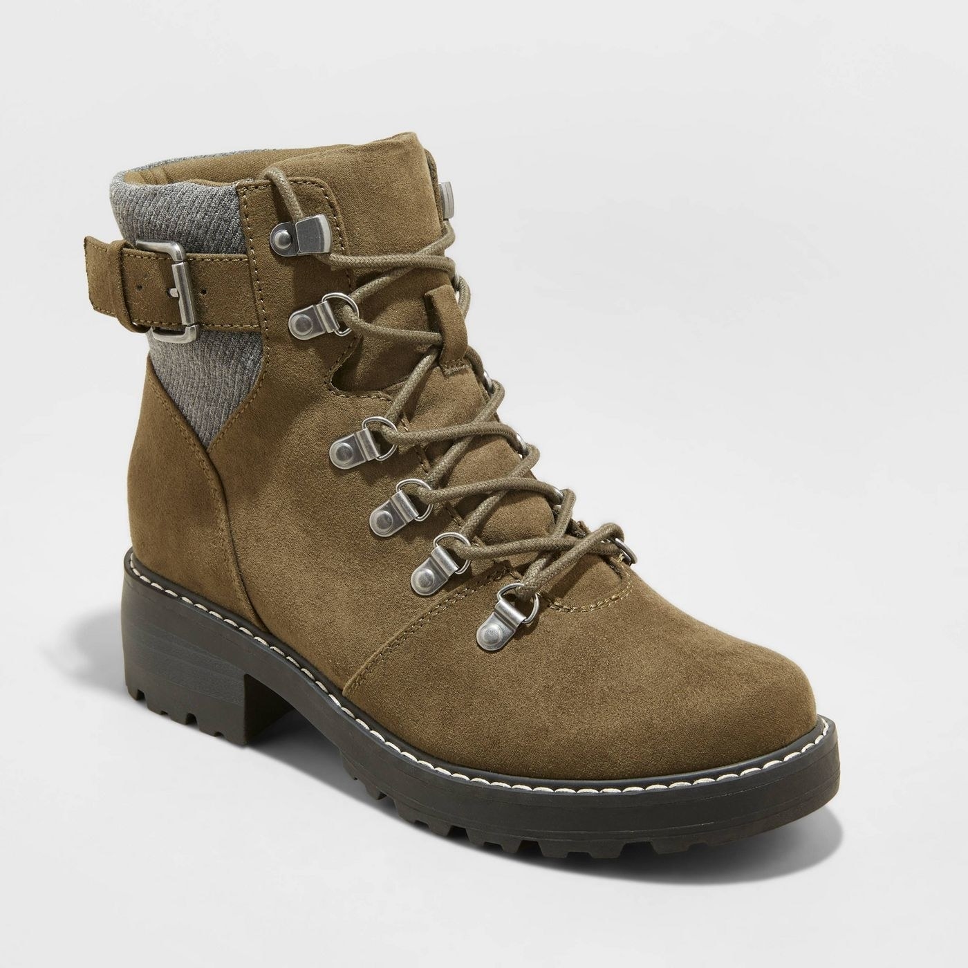 An olive green lace up hiking boot