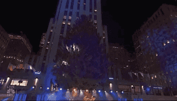 GIF of the Christmas tree at Rockefeller Center lighting up