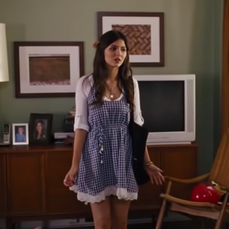 Wren wearing checkered blue dress and white t-shirt