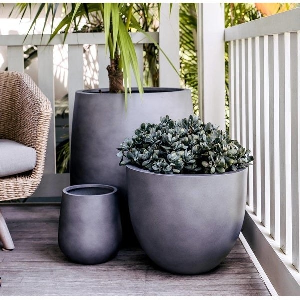 large gray rounded planters on a deck