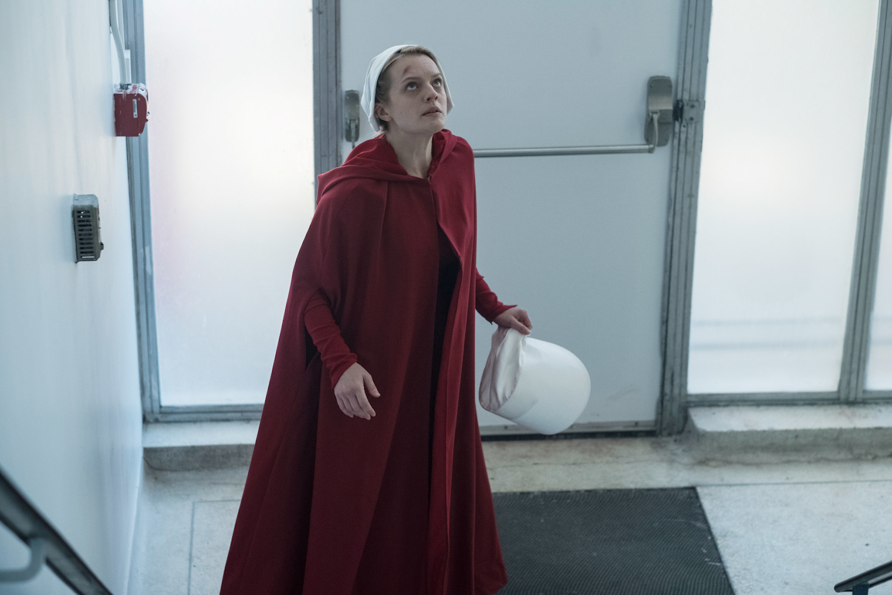 June trying to escape in her handmaid outfit