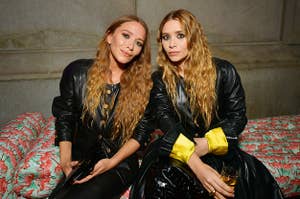 Mary-Kate and Ashley Olsen sit next to each other at the 2019 Met Gala