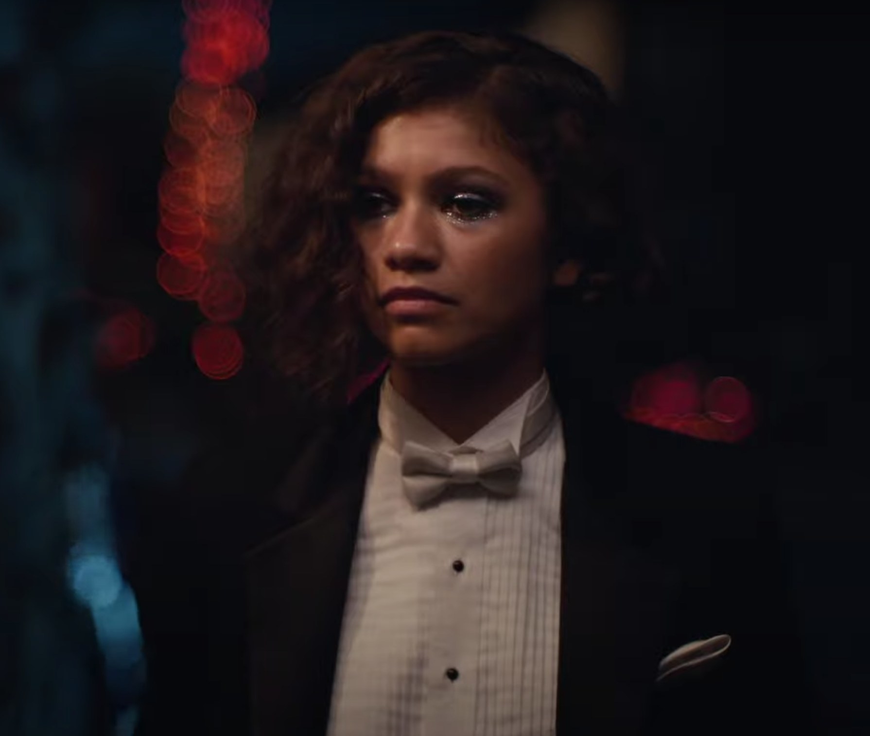Rue in tuxedo and sparkly eye makeup
