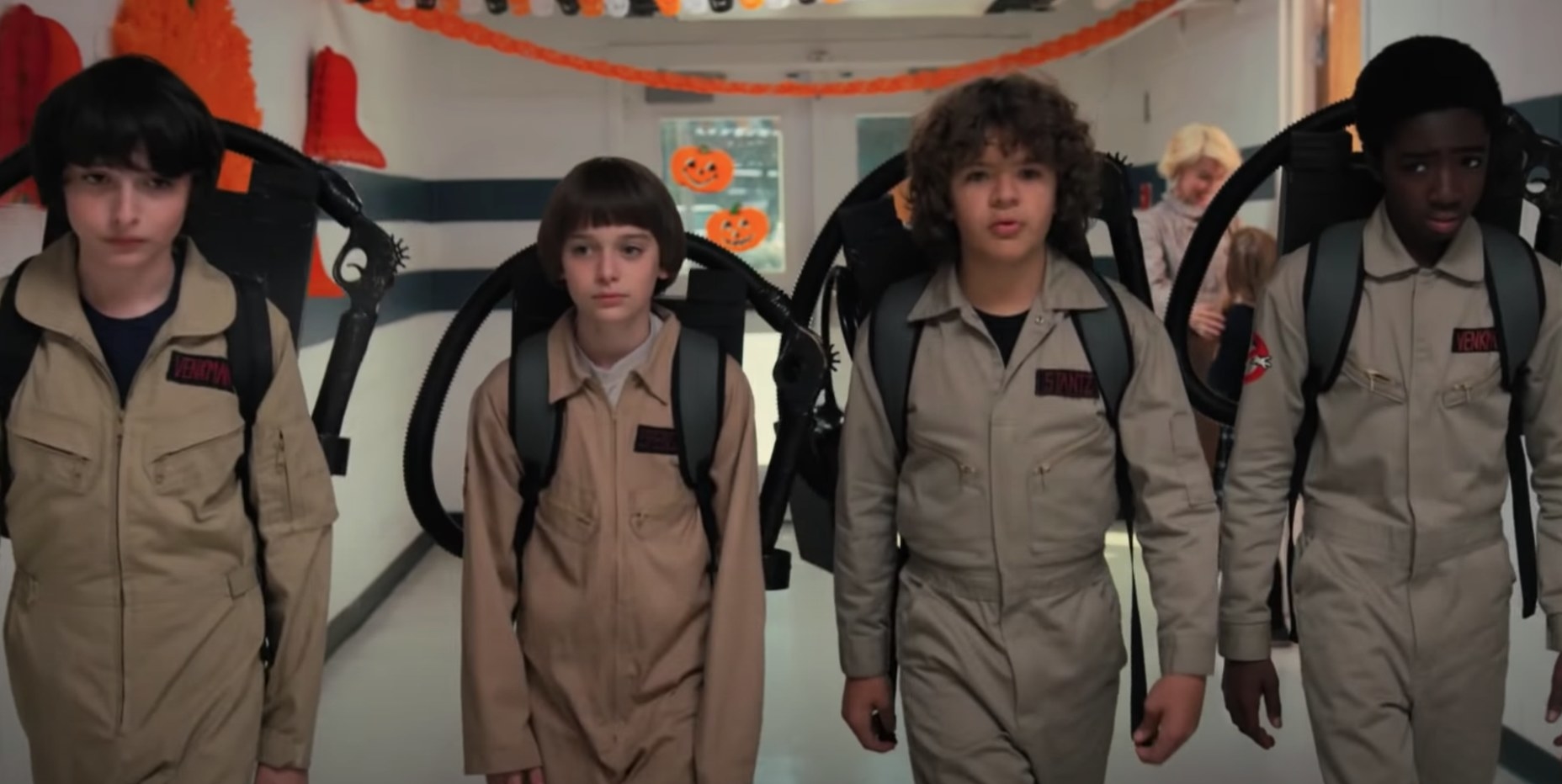 Mike, Will, Dustin, and Lucas in Ghostbuster costumes