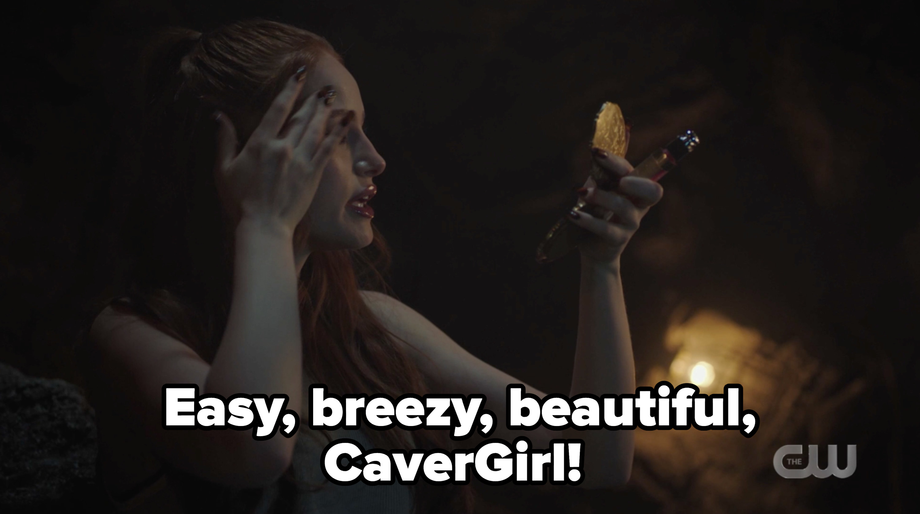 Cheryl applying makeup with the slogan easy, breezy, beautiful, cavergirl