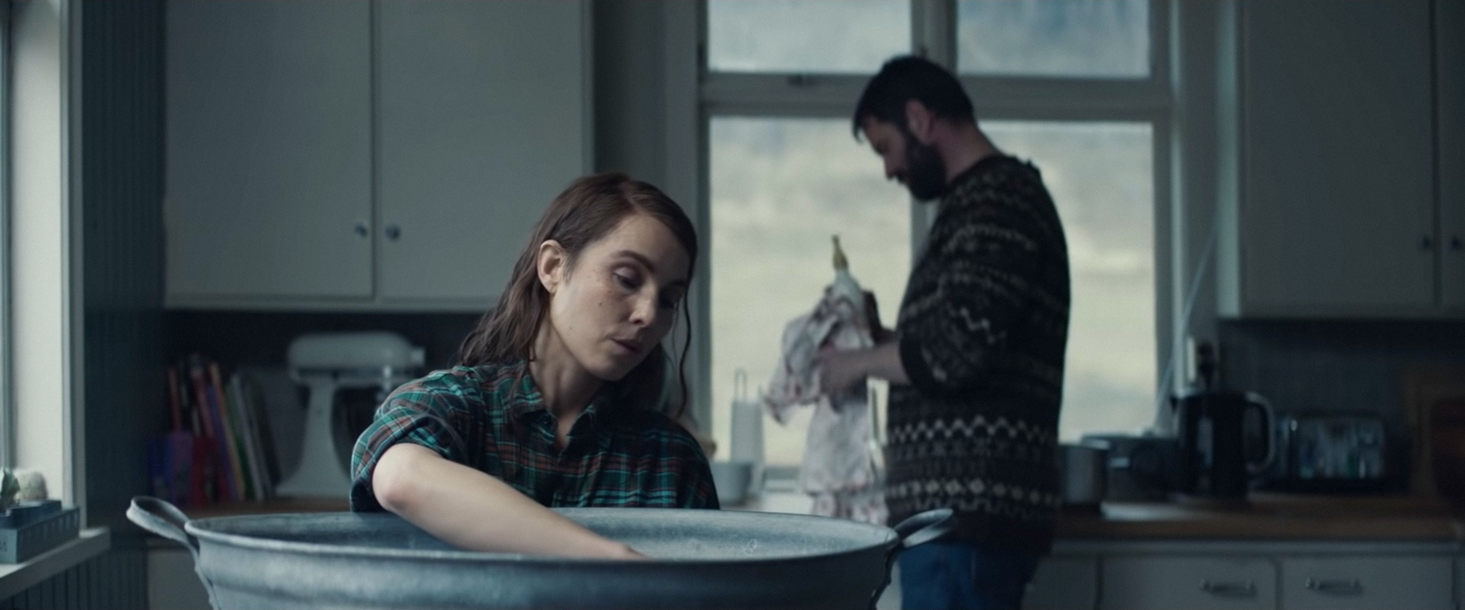 Maria and Ingvar in the kitchen doing chores