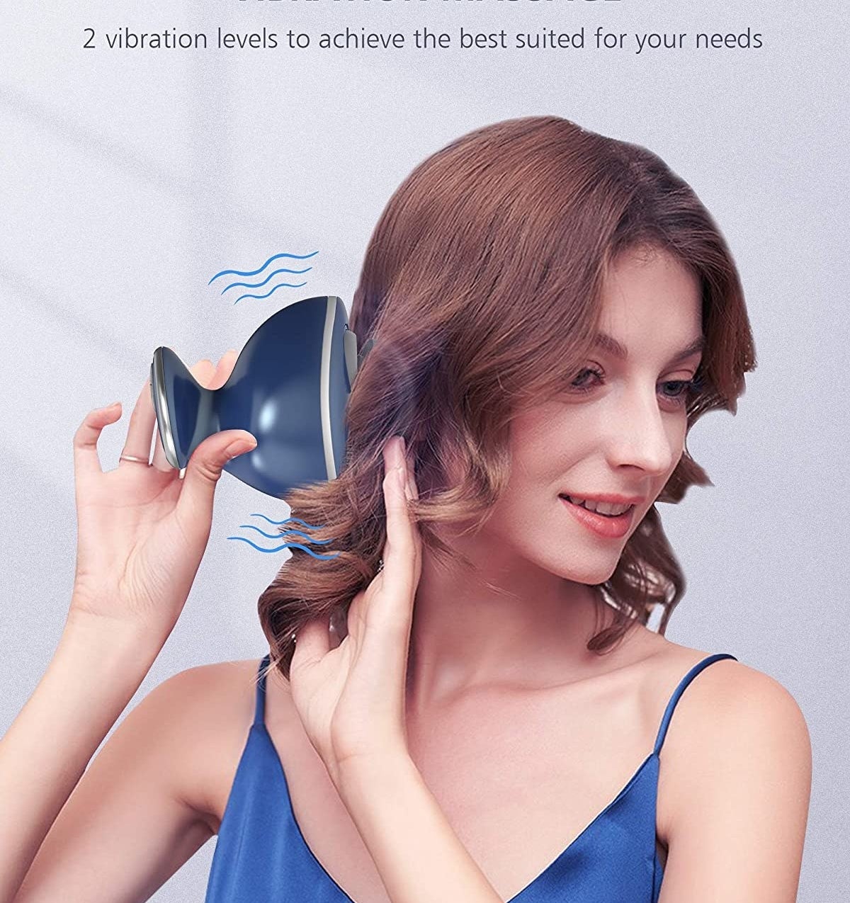 model using the scalp massager on their head