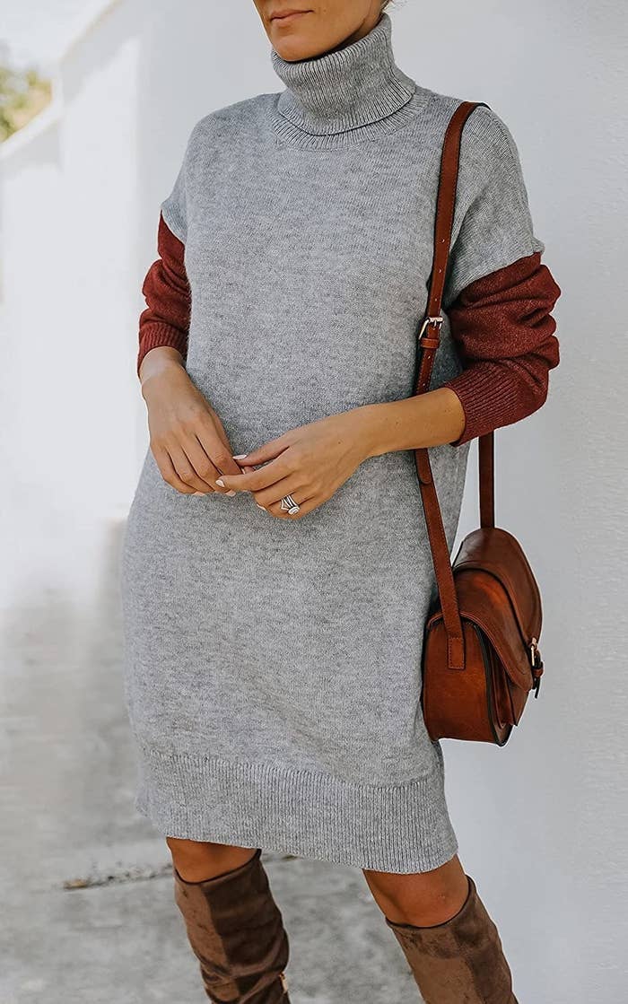 A model wearing the dress in gray with brown sleeves
