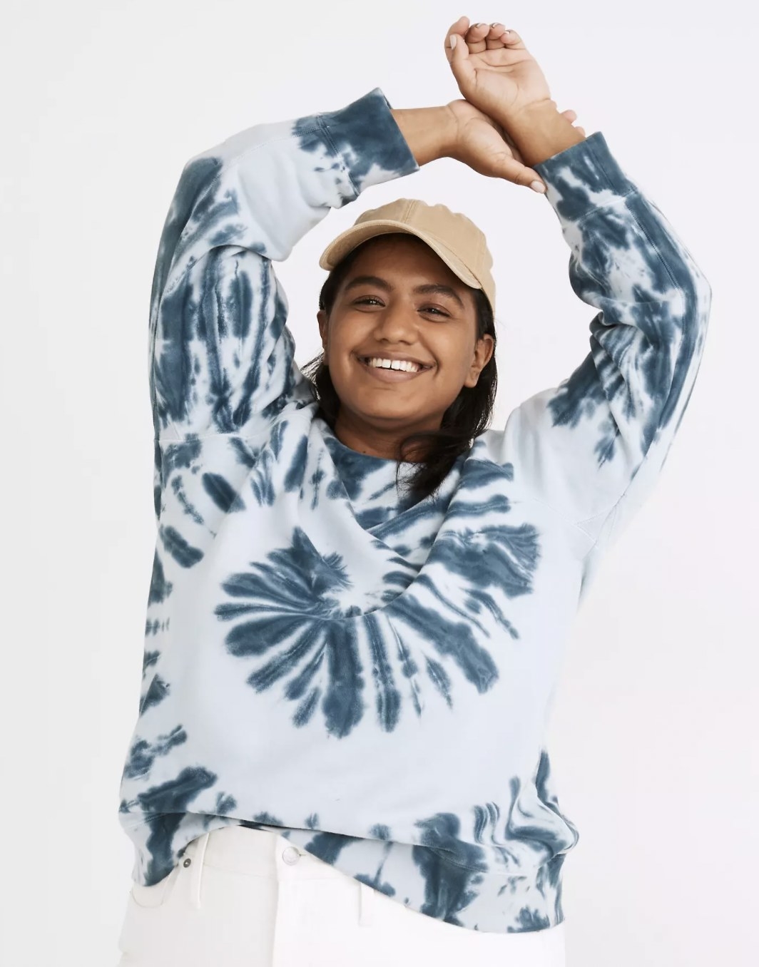 Model wearing a teal and baby blue tie dye sweater