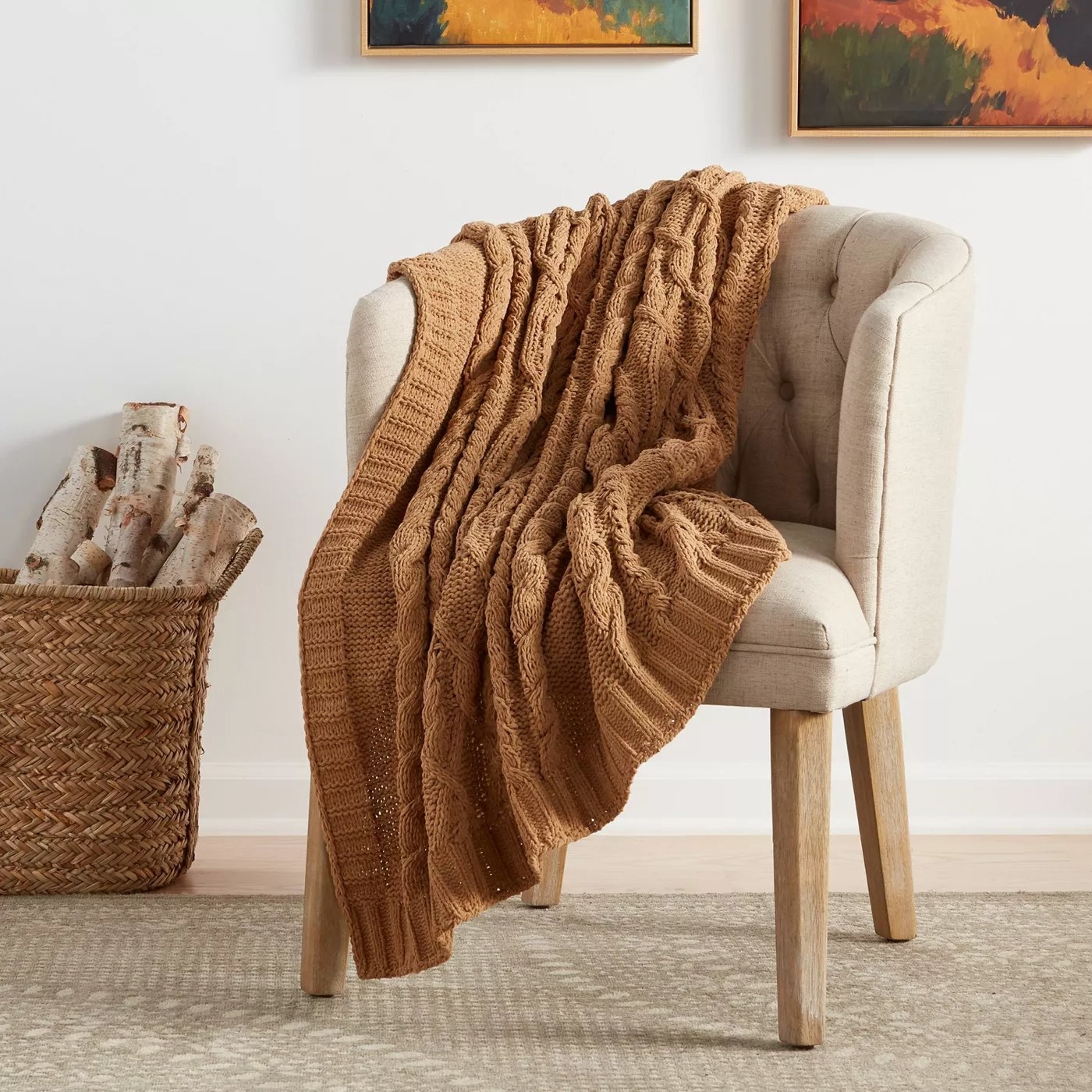 The tan knit throw resting on a chair