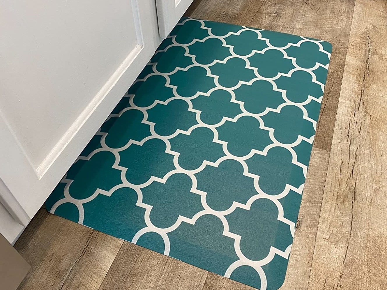 Reviewer photo of the kitchen mat on a hardwood floor