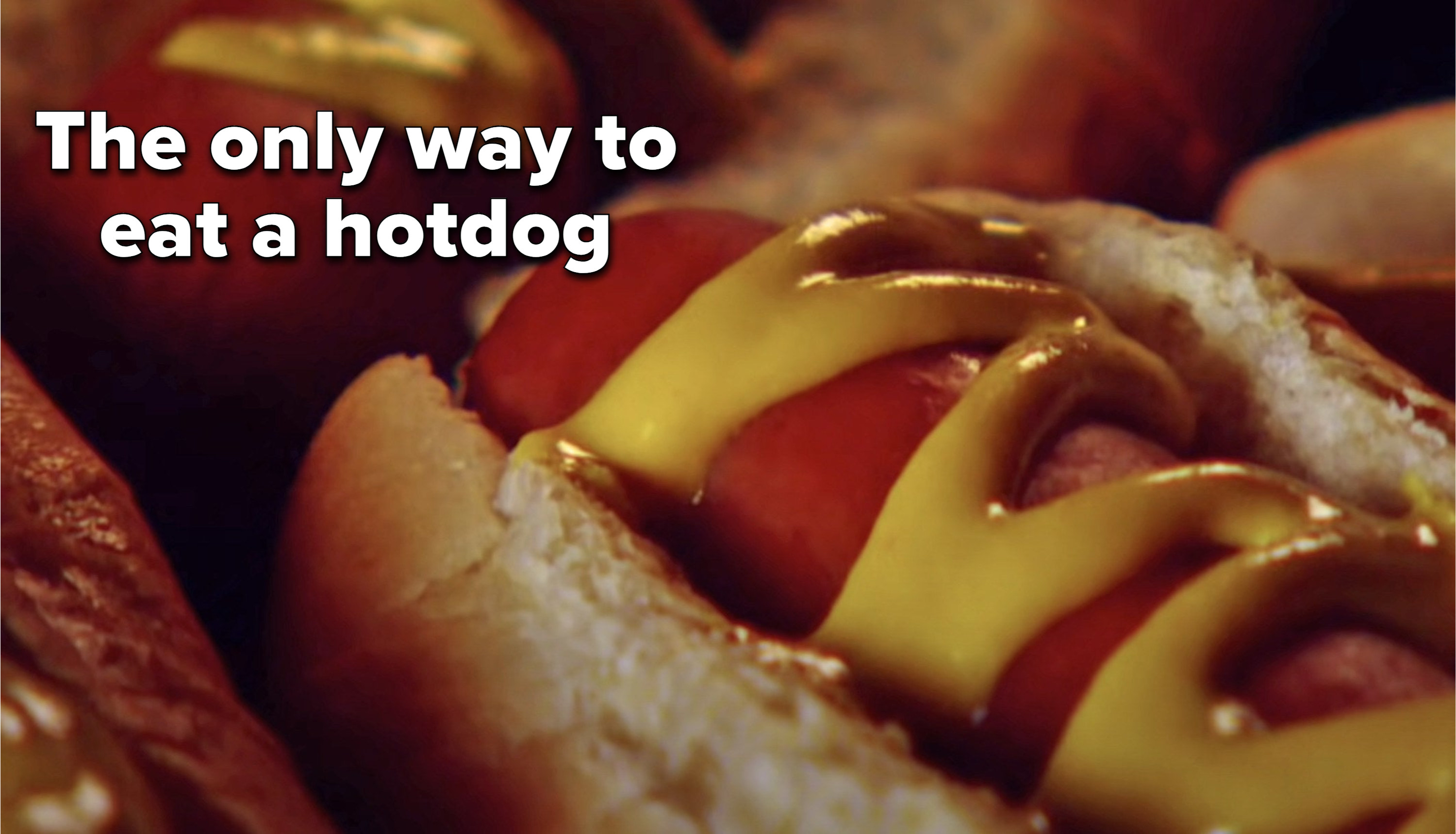 A hotdog with mustard on it