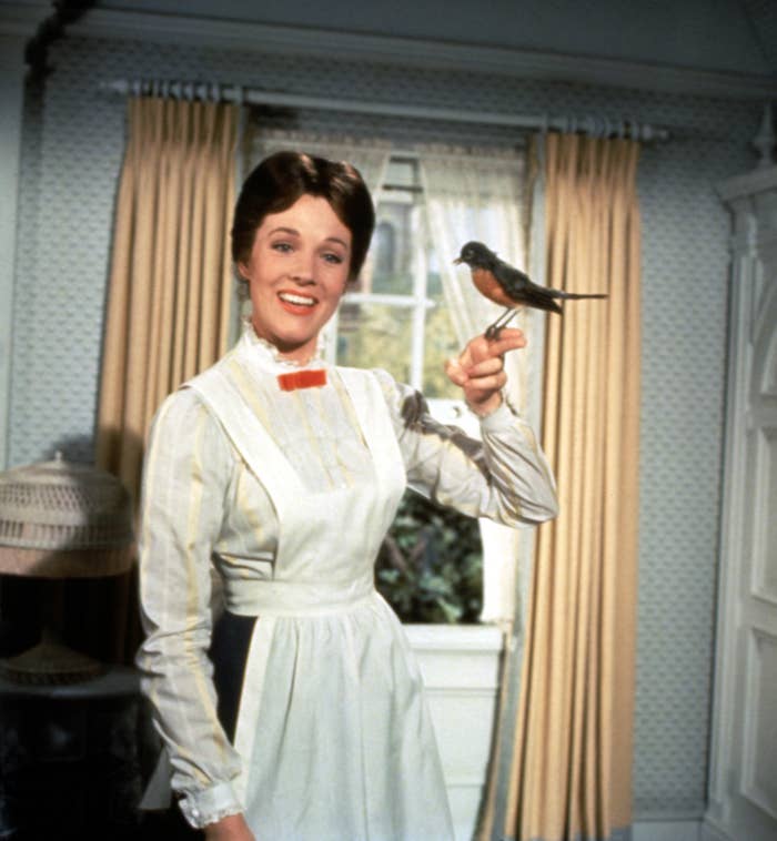 Mary Poppins holding a bird on her finger