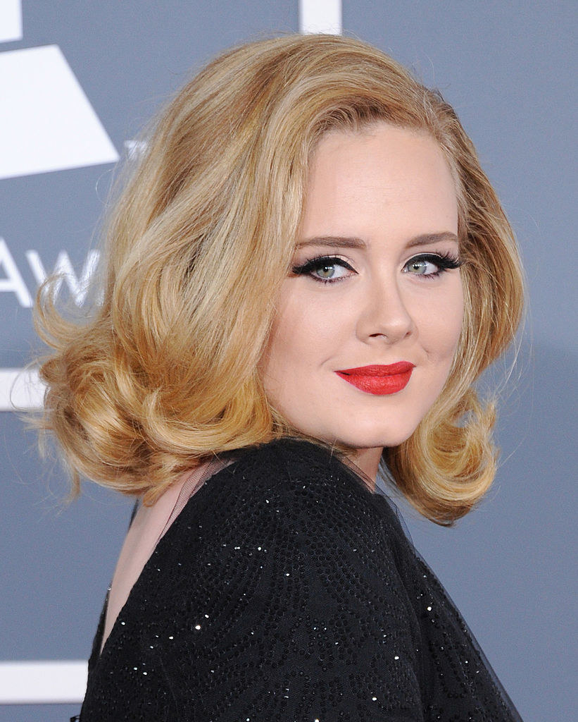 Adele poses on the red carpet at 54th Annual Grammy Awards