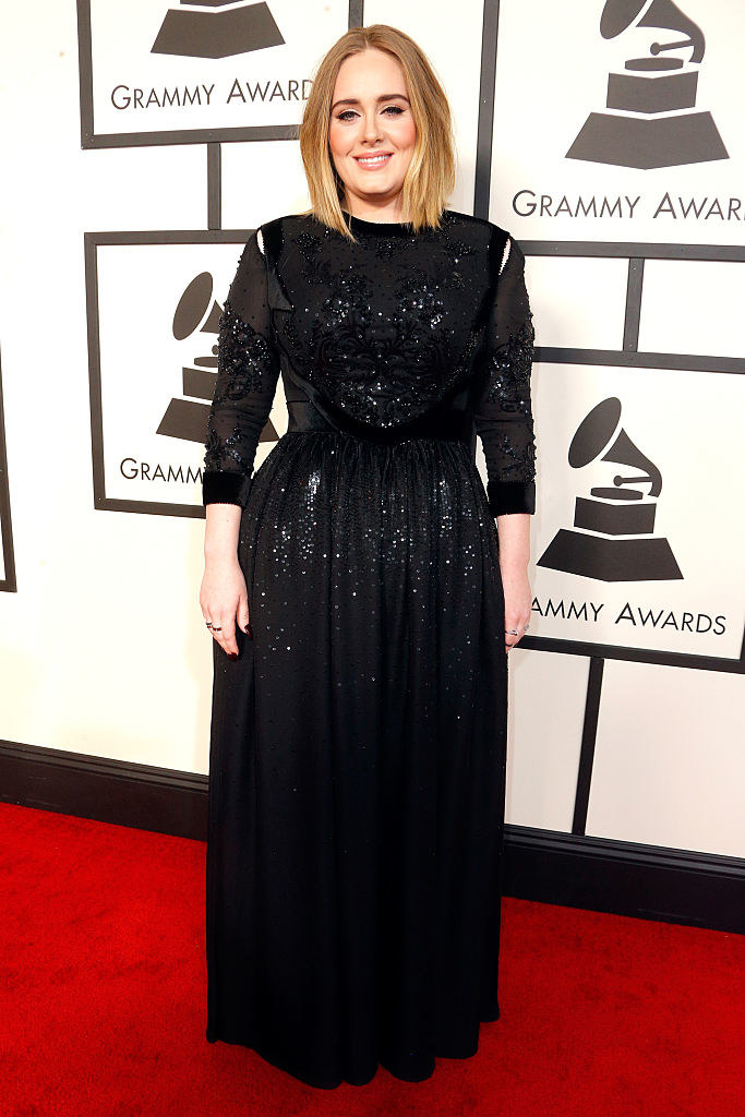 Adele smiles on the red carpet of the 58th Grammy Awards