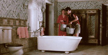 Scene from the movie The Money Pit where a bathtub crashes through the ceiling