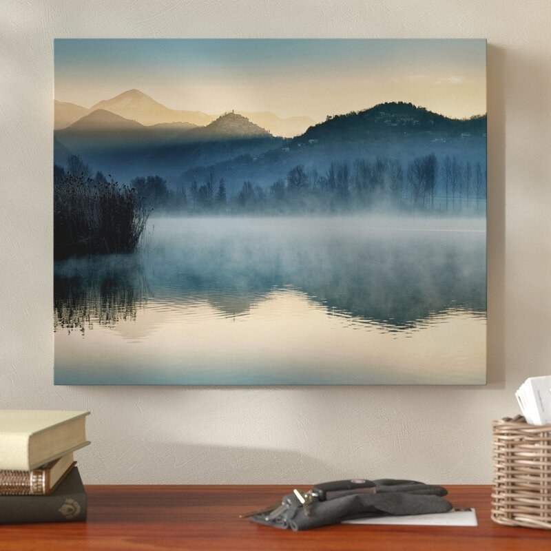 The canvas with a foggy mountain lake landscape