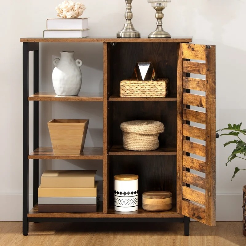 A three-tier accent cabinet with shelf