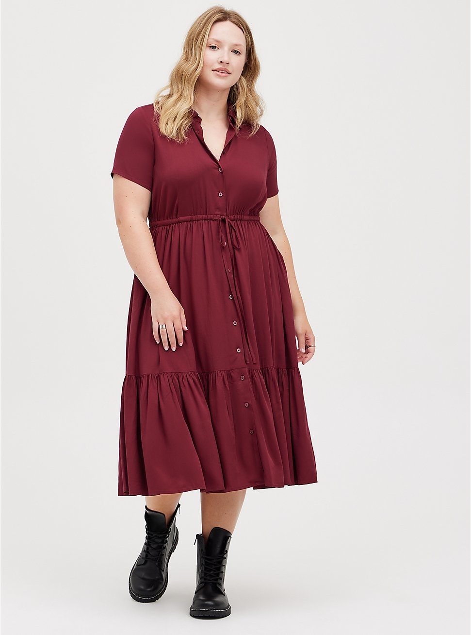 model in burgundy short sleeved tiered midi with tie waist